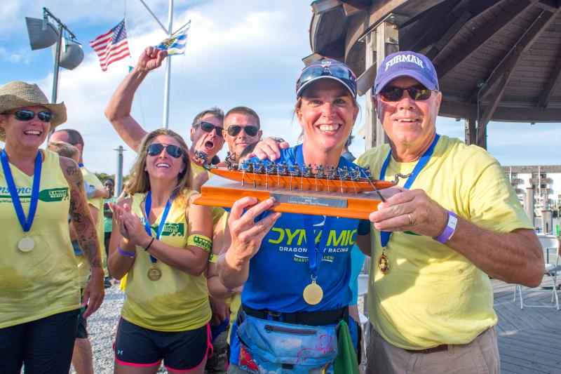 Team Lingo gets in sync to win it, accepting the 2016 Lewes Dragon Boat Festival championship trophy are Bill Lingo, right, along with Oarswoman Penny Behling, Dynamic Dragon Boat Racing, who focused the team together in the final round for the win. Also pictured (l-r) are Amy Hopkins, Kelly Horsey, Gene Davolos and Bill Lingo. DENY HOWETH PHOTOS